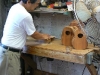 Alvin Okami demonstrates the sanding machine.